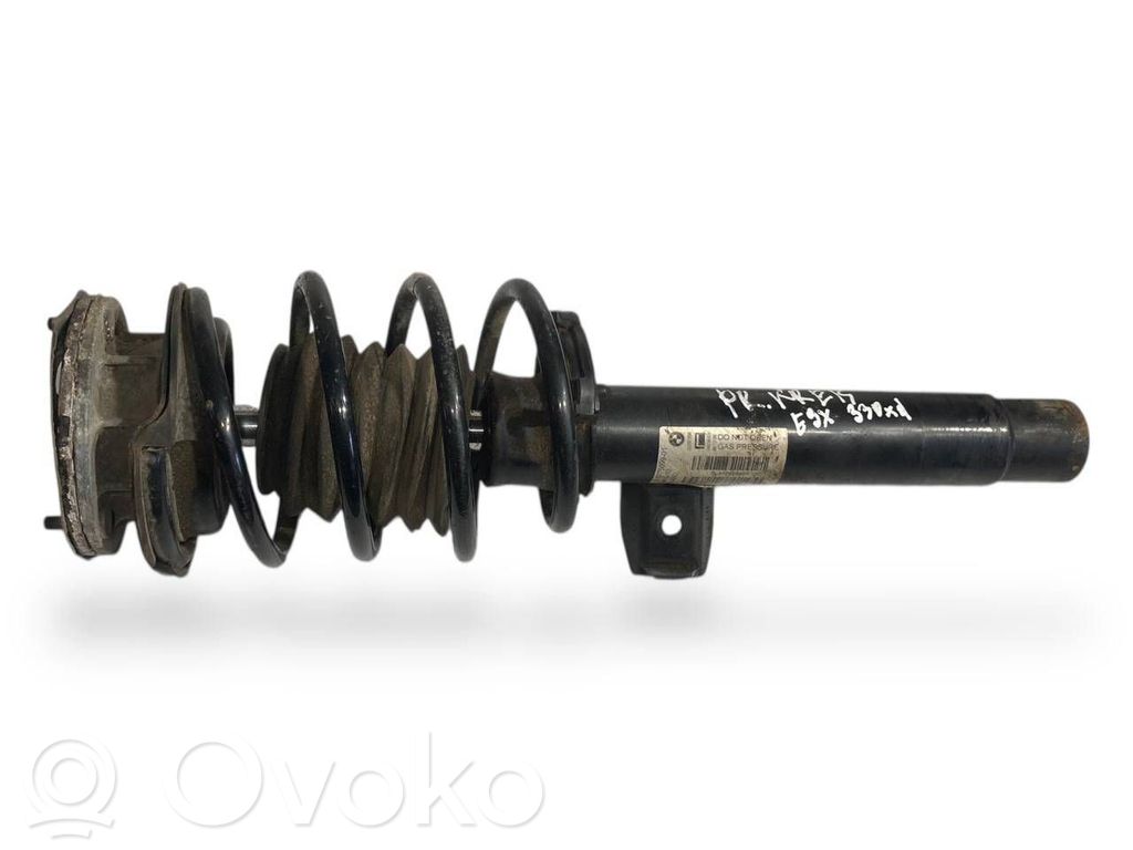 Front shock absorber with spring