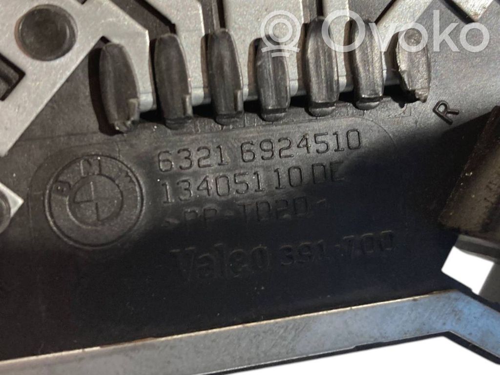 Aizmugures spuldzes vāka turētājs