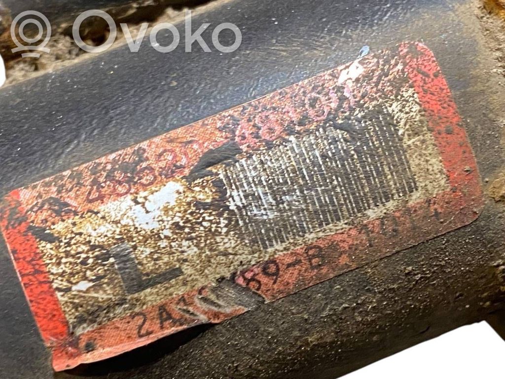 Priekšpusē amortizators ar atsperi