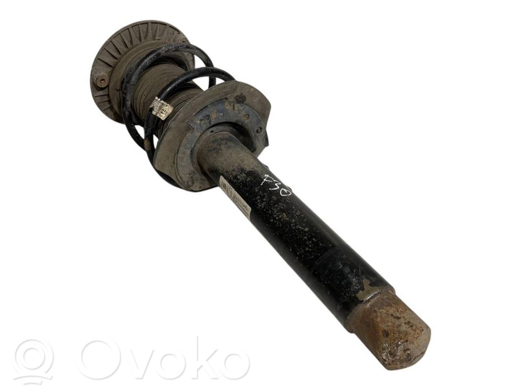Front shock absorber with spring