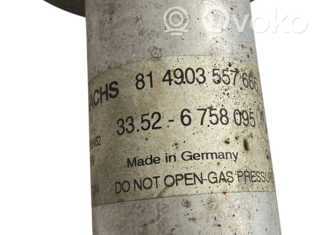 Aizmugurē amortizators ar atsperi