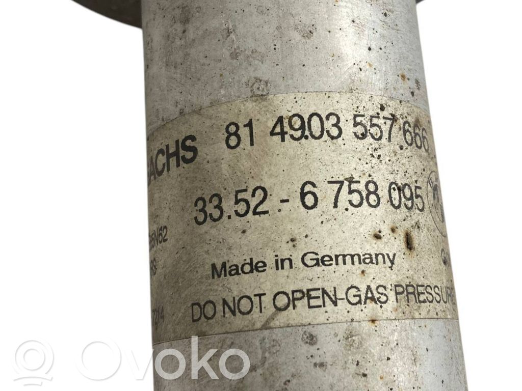 Aizmugurē amortizators ar atsperi