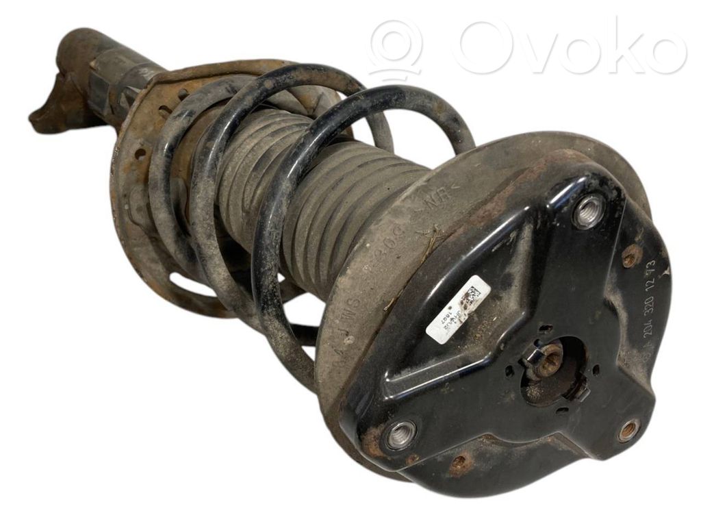 Front shock absorber with spring