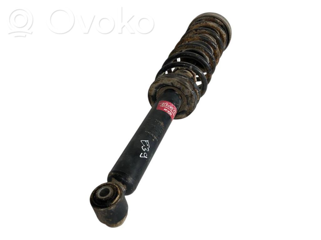 Rear shock absorber with spring