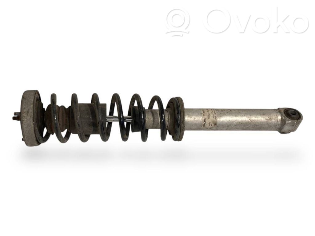 Rear shock absorber with spring