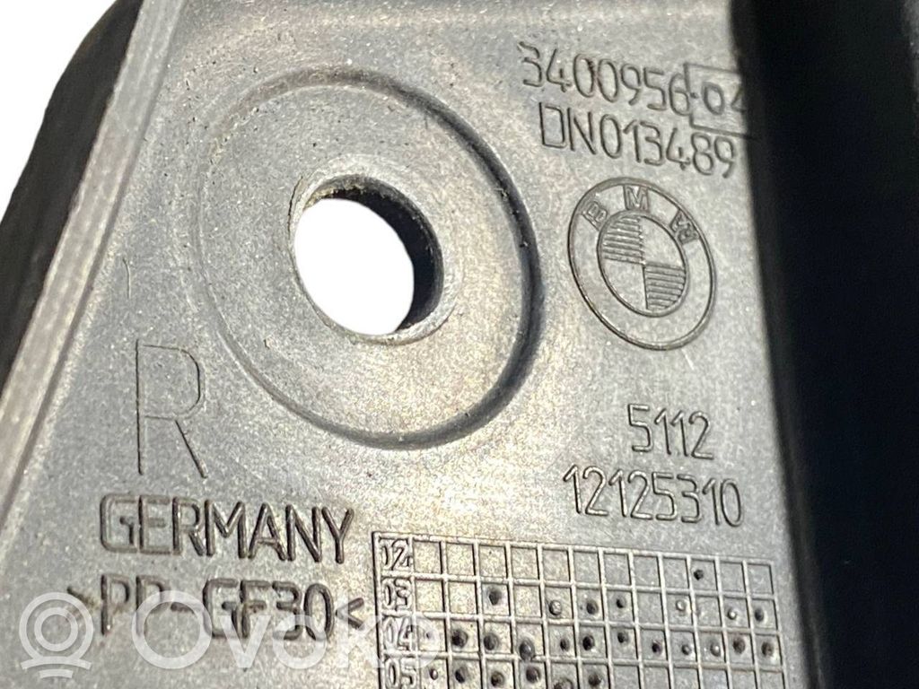 Держатель переднего бампера