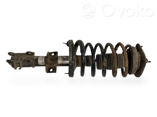 Priekšpusē amortizators ar atsperi