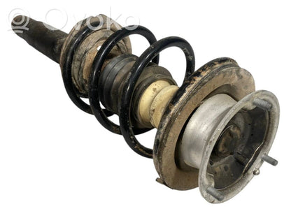 Priekšpusē amortizators ar atsperi