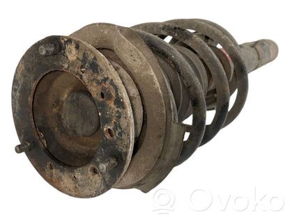 Priekšpusē amortizators ar atsperi