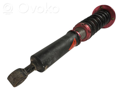 Rear shock absorber with spring