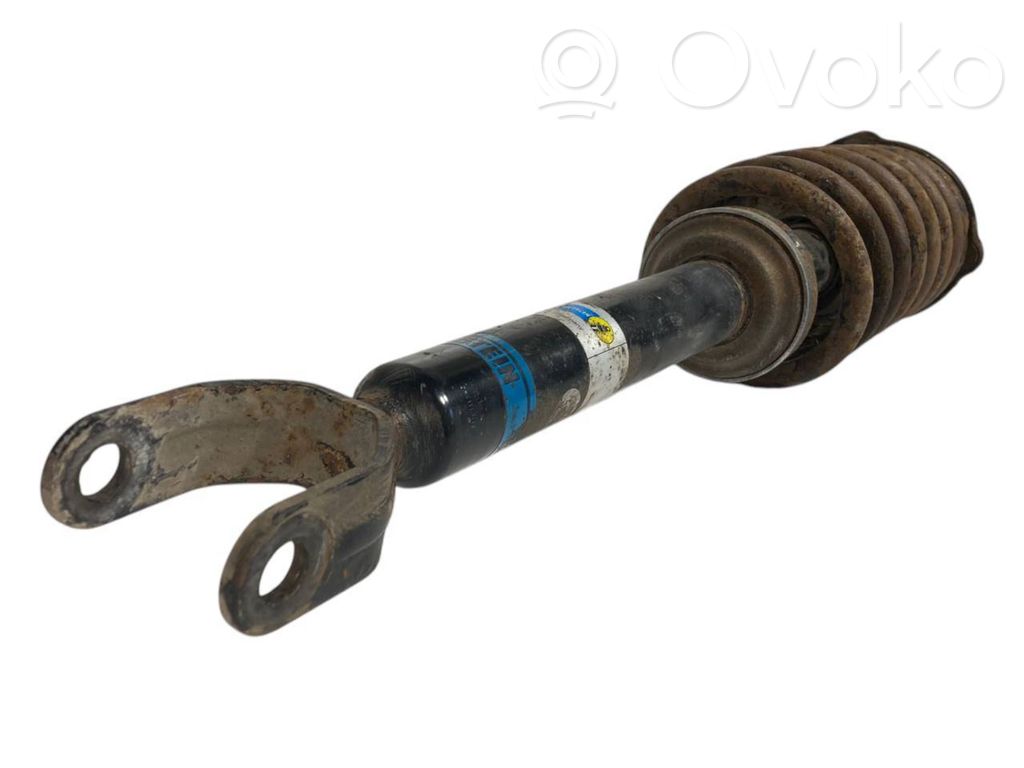 Priekšpusē amortizators ar atsperi