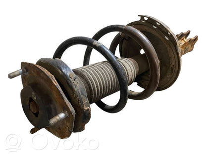 Priekšpusē amortizators ar atsperi