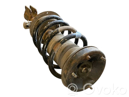 Priekšpusē amortizators ar atsperi