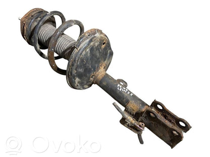 Priekšpusē amortizators ar atsperi