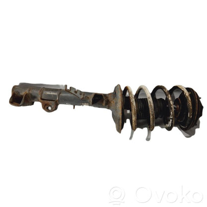 Priekšpusē amortizators ar atsperi