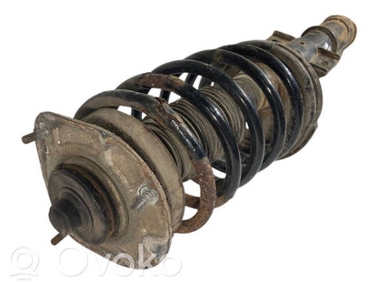 Priekšpusē amortizators ar atsperi