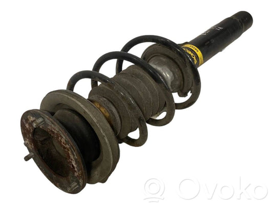 Priekšpusē amortizators ar atsperi