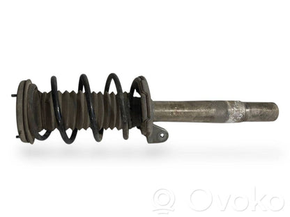 Priekšpusē amortizators ar atsperi