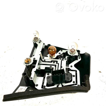 Aizmugures spuldzes vāka turētājs