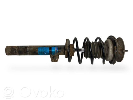 Priekšpusē amortizators ar atsperi