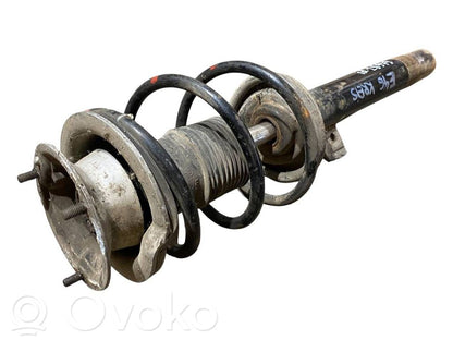 Priekšpusē amortizators ar atsperi