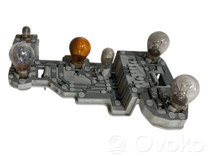 Aizmugures spuldzes vāka turētājs