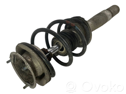 Priekšpusē amortizators ar atsperi