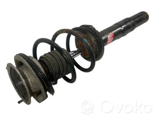 Priekšpusē amortizators ar atsperi