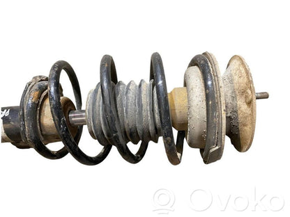 Priekšpusē amortizators ar atsperi