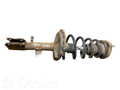 Aizmugurē amortizators ar atsperi