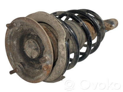 Priekšpusē amortizators ar atsperi