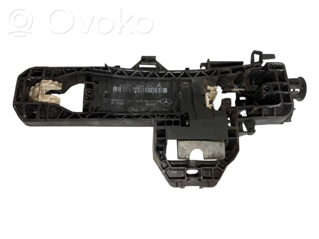 Priekšpusē turētājs / kronšteins ārējam atvēršanas rokturim