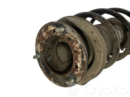 Priekšpusē amortizators ar atsperi