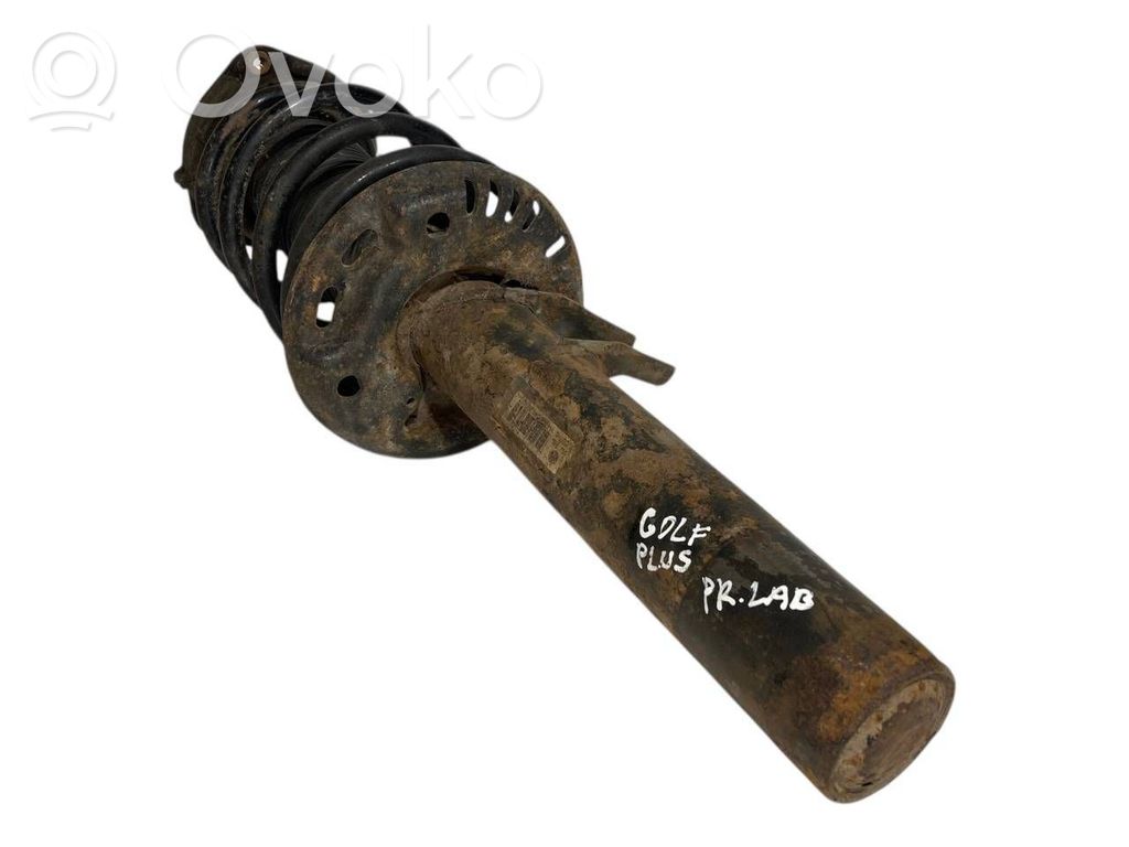 Priekšpusē amortizators ar atsperi