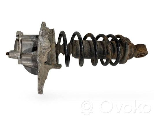 Aizmugurē amortizators ar atsperi