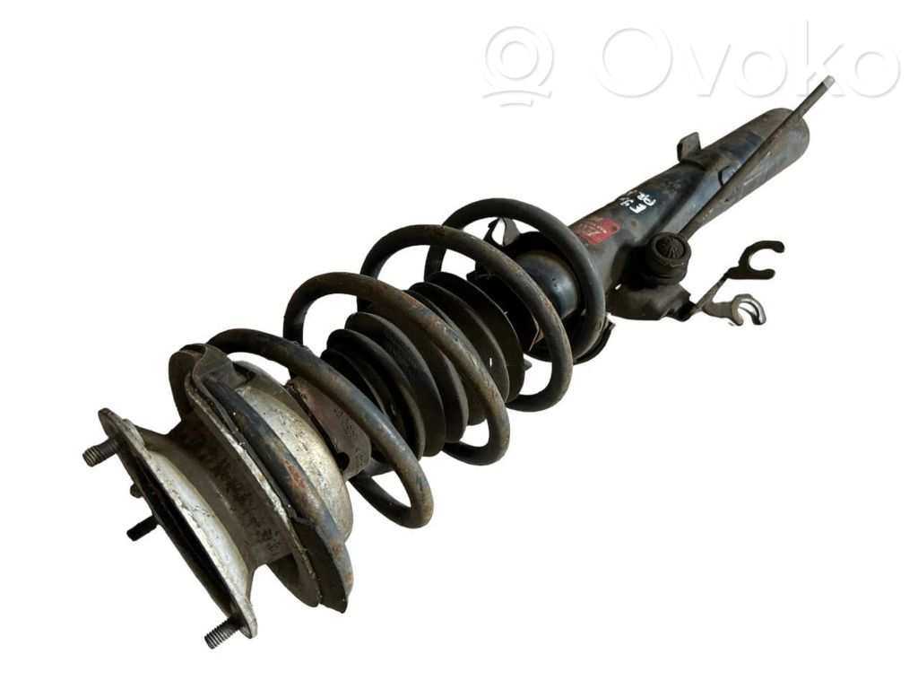 Priekšpusē amortizators ar atsperi