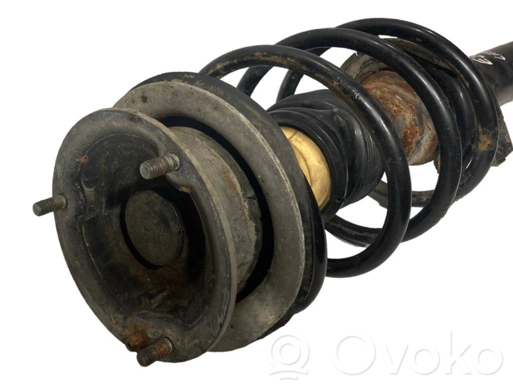 Priekšpusē amortizators ar atsperi