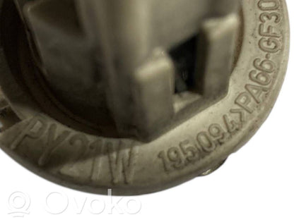 Aizmugures spuldzes vāka turētājs