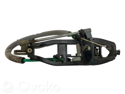 Priekšpusē turētājs / kronšteins ārējam atvēršanas rokturim