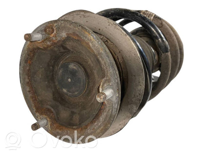 Priekšpusē amortizators ar atsperi