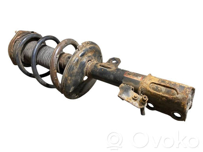 Priekšpusē amortizators ar atsperi