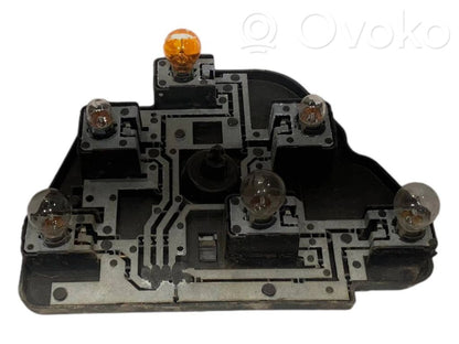 Aizmugures spuldzes vāka turētājs