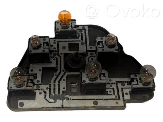 Aizmugures spuldzes vāka turētājs