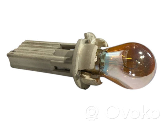 Aizmugures spuldzes vāka turētājs