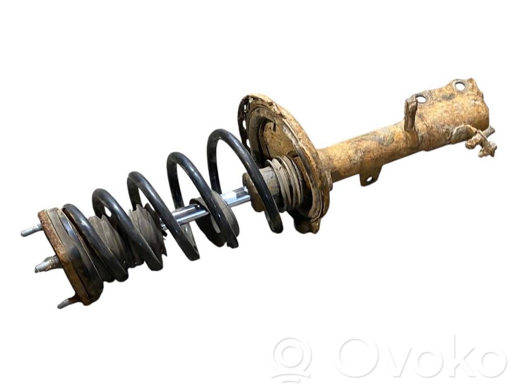 Aizmugurē amortizators ar atsperi