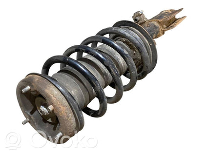 Priekšpusē amortizators ar atsperi