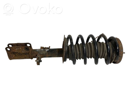 Front shock absorber with spring