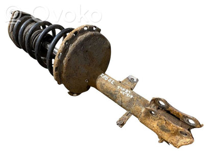 Aizmugurē amortizators ar atsperi