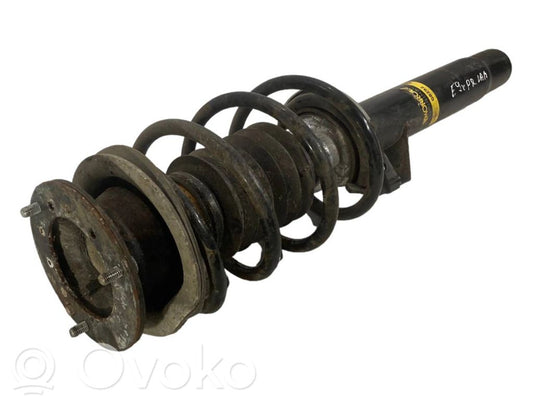 Priekšpusē amortizators ar atsperi