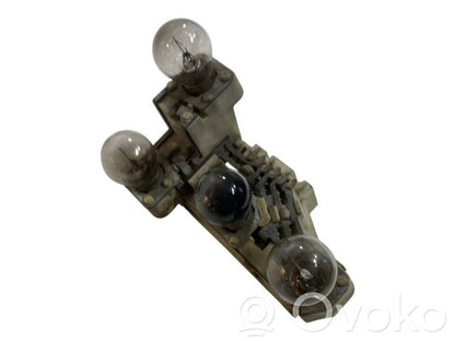 Aizmugures spuldzes vāka turētājs